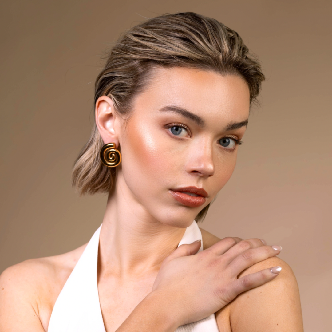 Cora spiral 18k gold hypoallergenic statement earrings seashell front model cover photo