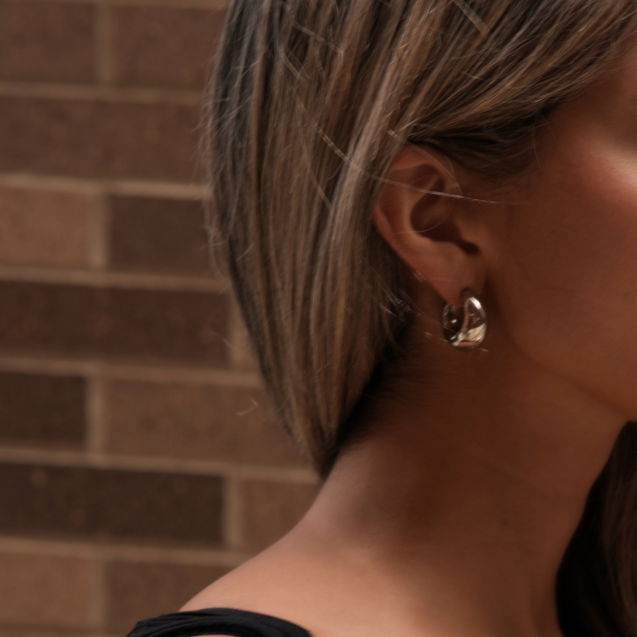 18k gold plated stainless steel surgical gia hoop earrings on model