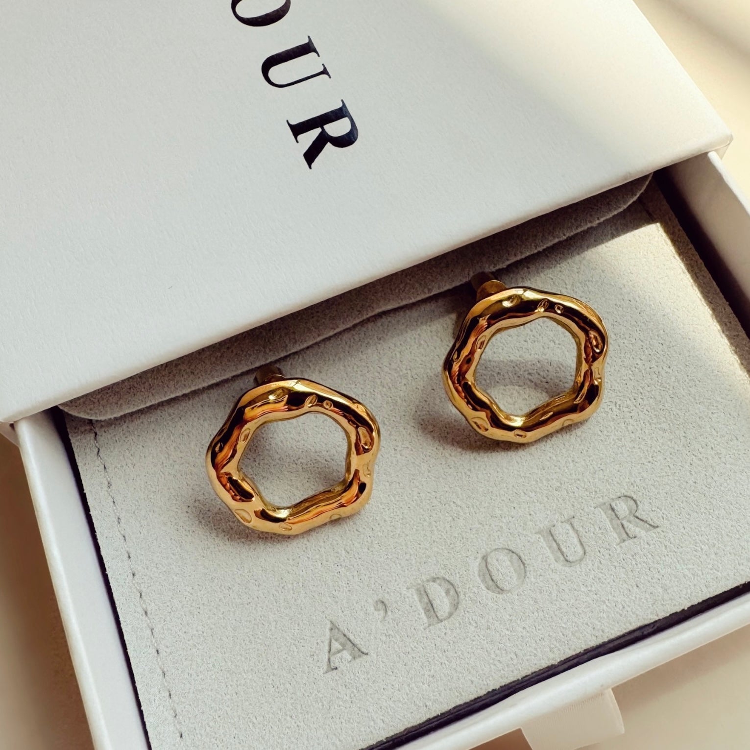18k gold stainless steel statement earrings oval shaped nova display photo on adour box