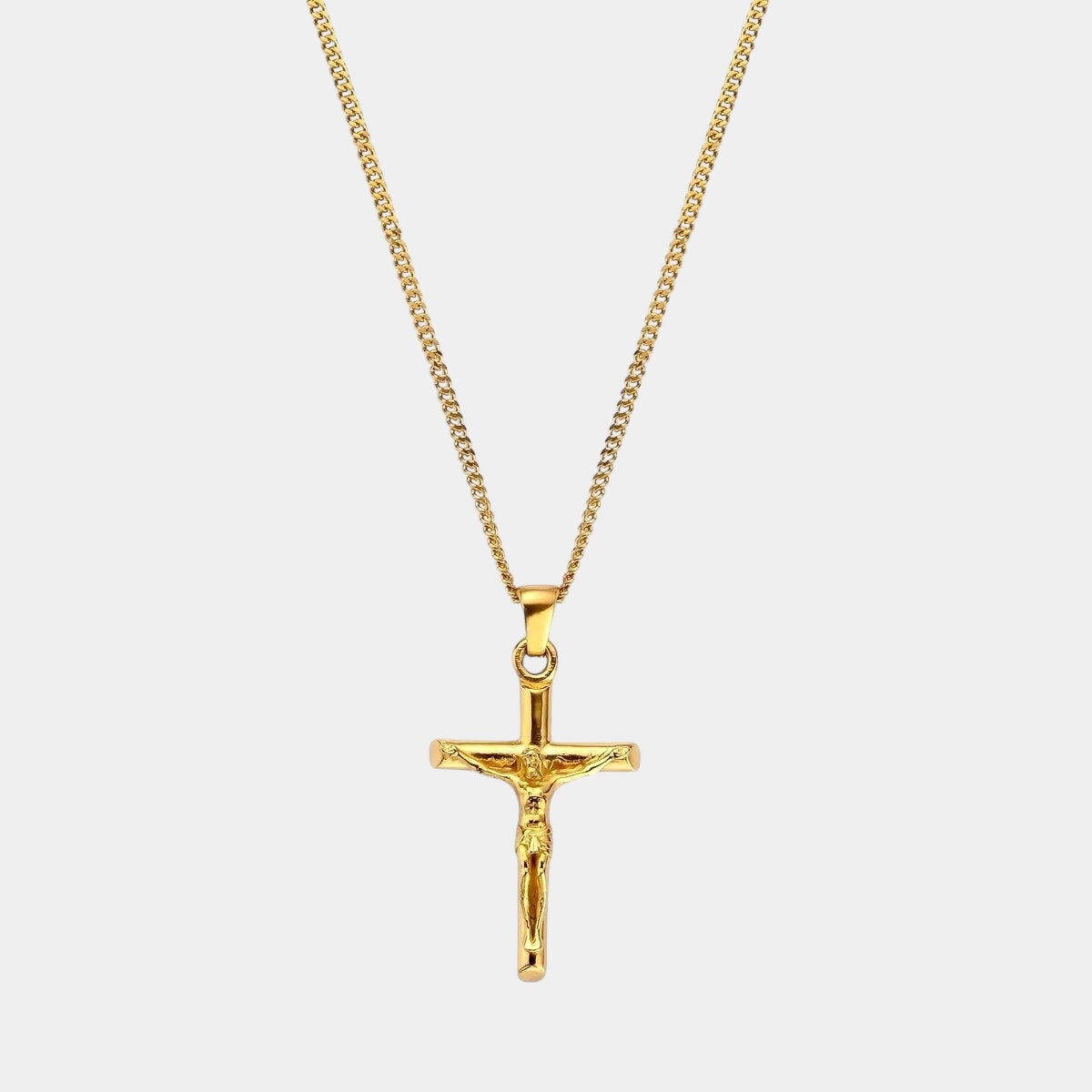 Gold crucifix necklace 18 karat hypoallergenic with chain close-up photo jesus 