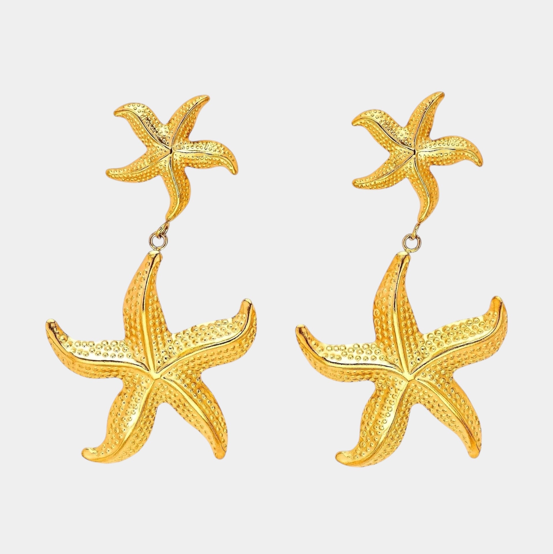 Calypso 18 karat hypoallergenic gold starfish dangle earrings front view