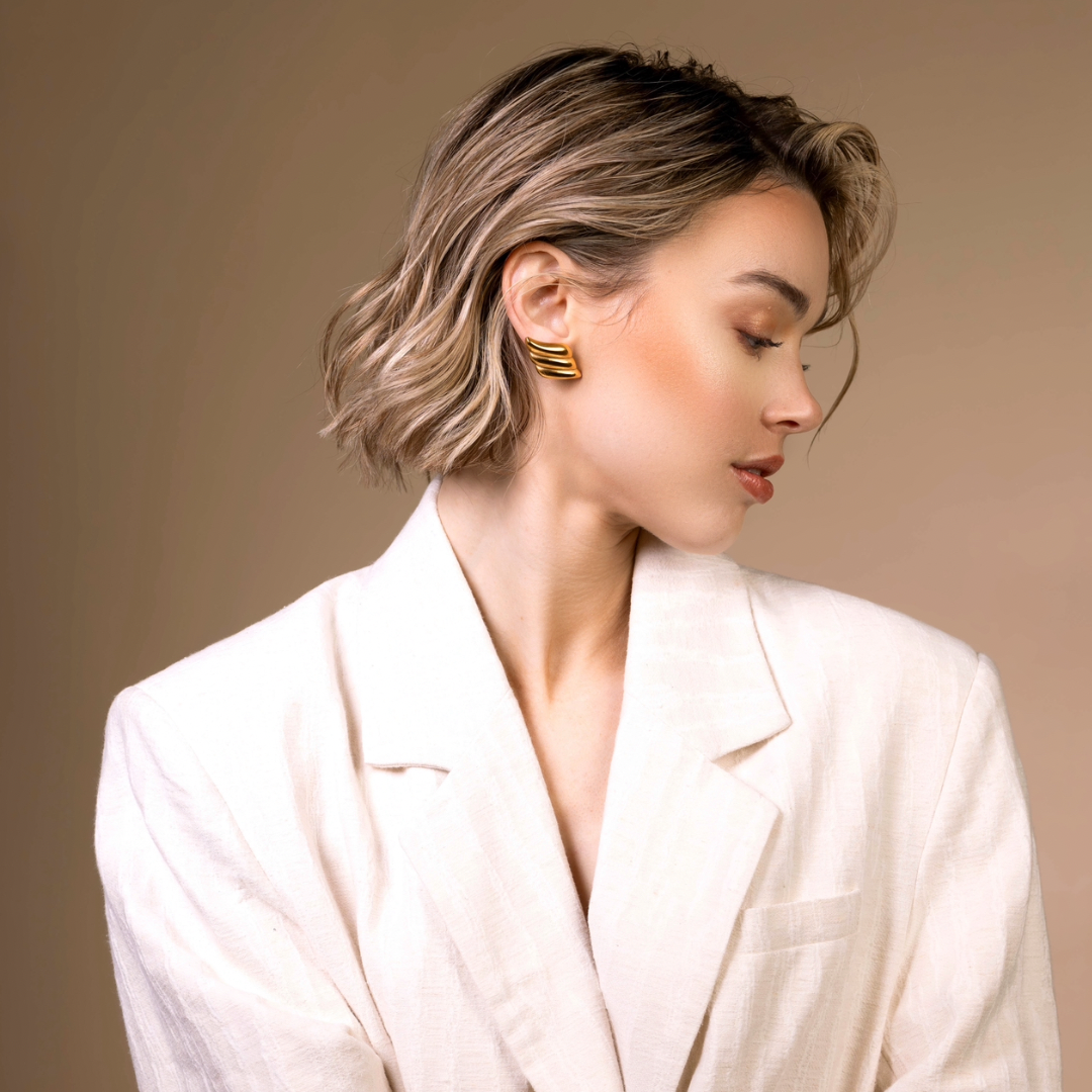 Esme gold statement wing earring model photo