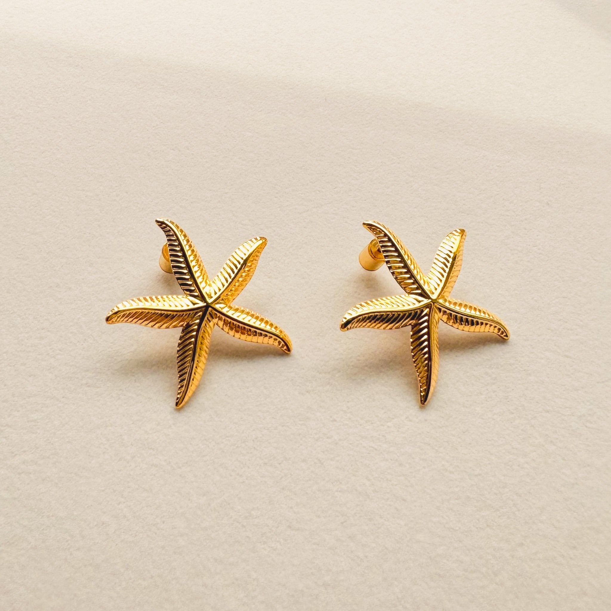 18k gold plated hypoallergenic stainless steel statement earrings sienna starfish display photo trendy summer on tray